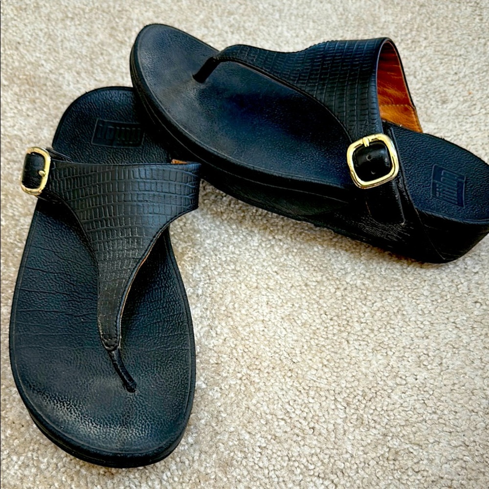 Women’s black sandals with gold buckle. Great shape last forever